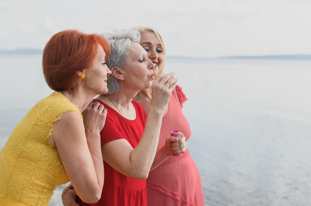 Mature women traveling together by the water